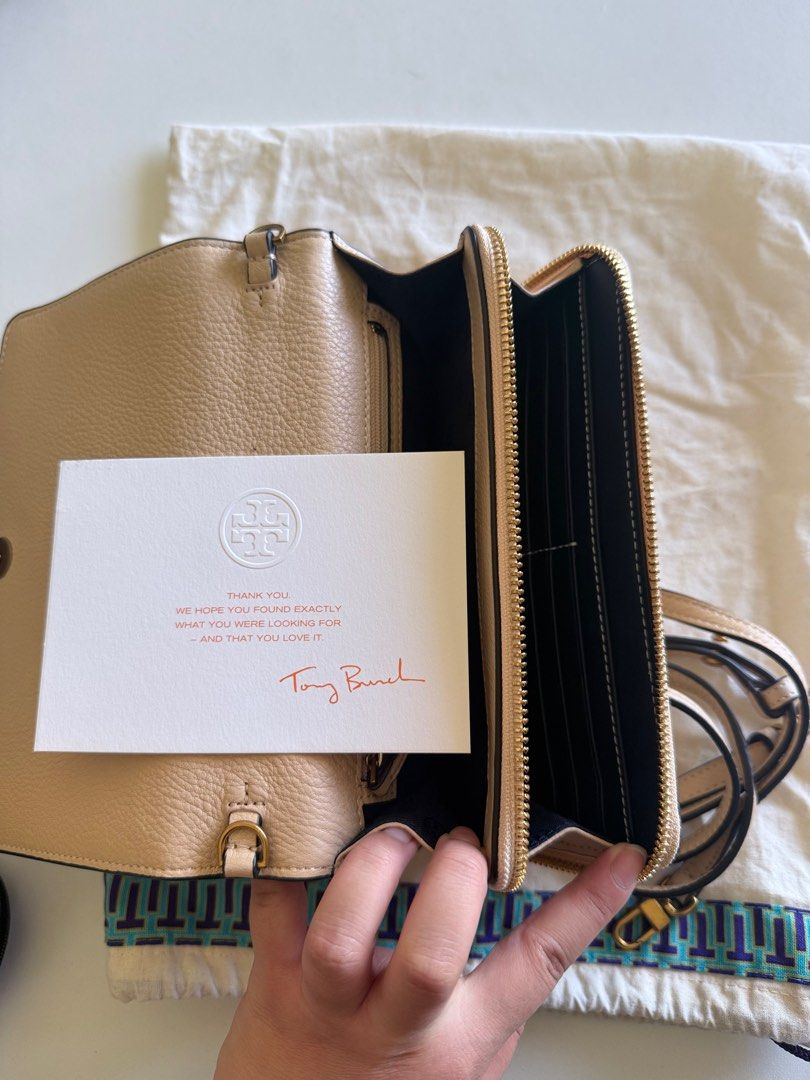 Tory Burch Perforated Logo Fold-Over Crossbody bag (Category: Luxury Bags & Wallets) located in Manila. Submitted by nikkib3eee (Listing ID 1374896095, Image 3). Description: Brand New Never Used Cross body bag with 6 card slots With sling STYLE NO. 39951 COLOR/CODE SAND DUNE / 251.