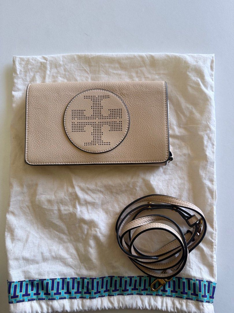 Tory Burch Perforated Logo Fold-Over Crossbody bag (Category: Luxury Bags & Wallets) located in Manila. Submitted by nikkib3eee (Listing ID 1374896095, Image 1). Description: Brand New Never Used Cross body bag with 6 card slots With sling STYLE NO. 39951 COLOR/CODE SAND DUNE / 251.