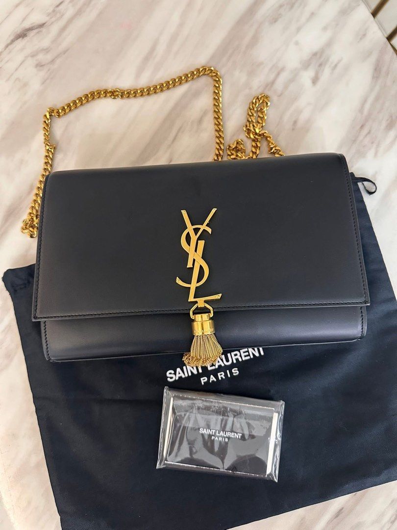 Authentic YSL Kate Medium with tassel (Category: Luxury Bags & Wallets) located in Quezon City. Submitted by jhaediah (Listing ID 1375234171, Image 1). Description: Medium gold kate with tassel With cards and dustbag Good condition Free pabitbit Korea.