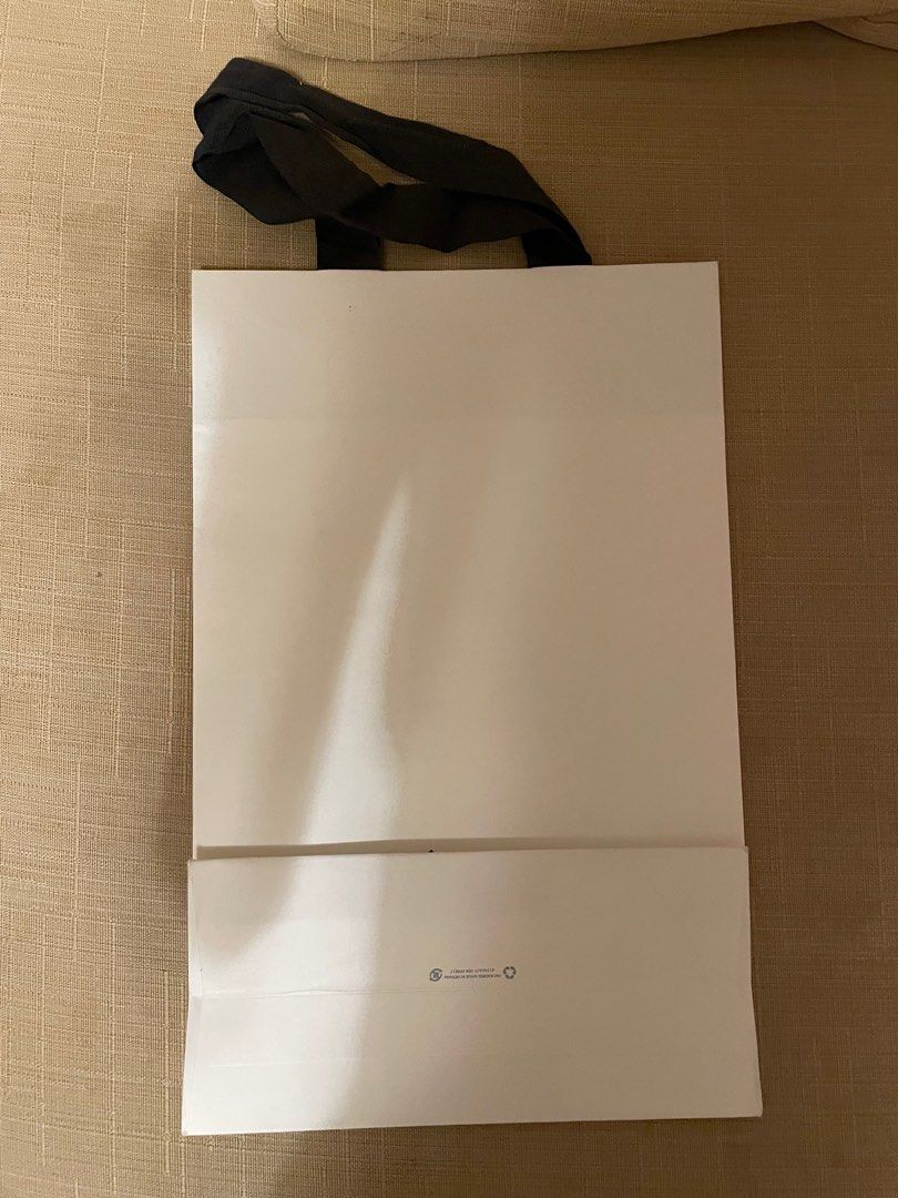 Celine paperbag (Category: Luxury Bags & Wallets) located in Cebu City. Submitted by kiki_closet168 (Listing ID 1375209997, Image 2). Description: Size 25.5cm x 39cm x 12cm Note: one side has sticker flaws n dirt.
