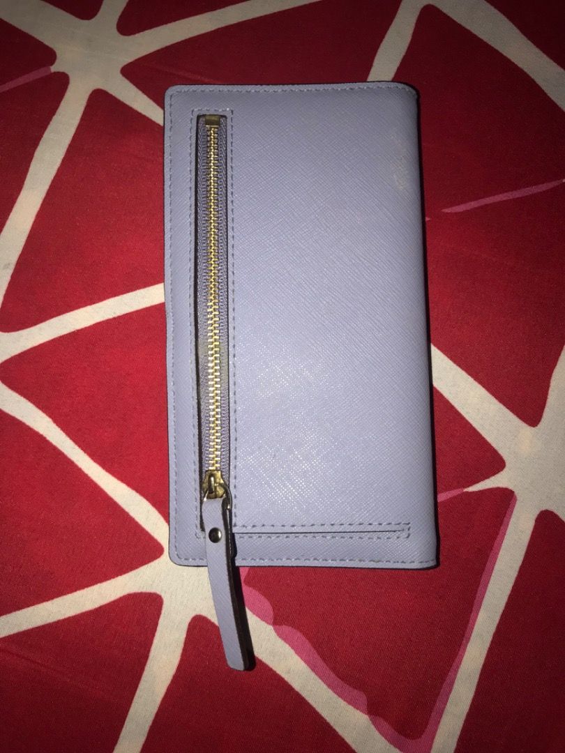 Kate Spade Stacy Bifold Wallet WLRU1601 (Category: Luxury Bags & Wallets) located in General Trias. Submitted by karinator (Listing ID 1375180976, Image 3). Description: ORIGINAL Kate Spade Newbury Lane Stacy Bifold Wallet WLRU1601 [Lilac-Coloured]. Bought for 138 CAD = PHP 5,300. Slightly used, only needs cleaning. RFS: Not my style e 😅 Nakatambak lang sa bahay. You can send me a message if you want more pictures. Price a bit negotiable for sur