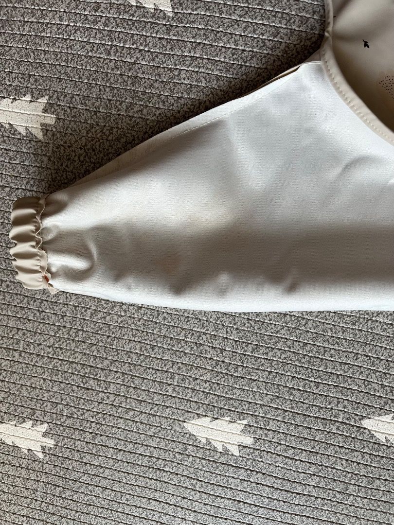 Konges Slojd waterproof baby toddler long sleeves bib (Category: Weaning & Toddler Feeding) located in Singapore. Submitted by bebechan (Listing ID 1375153159, Image 3). Description: First one is like new. Second has some stains on the sleeves inside. $8 for both..