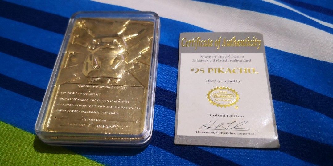 Pikachu 23K Gold Plated Card (Category: Raw Singles) located in Dagupan City. Submitted by ptrvncnt (Listing ID 1375192942, Image 2). Description: Based on my research, this was released by Nintendo in 1999. Been with me for over a decade now. Bought it somewhere. Pokeball shows wear and fading. Actual card is in pristine near mint condition with plastic casing, in my non-professional opinion. Never removed from the casing. Still has a small cert