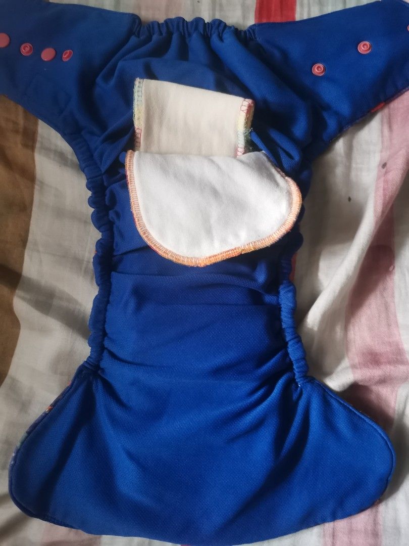 2pcs Preloved HF Cloth Diaper (Category: Diapers & Baby Wipes) located in Quezon City. Submitted by c_and_a_haus (Listing ID 1375325701, Image 3). Description: Cover type and pocket type. Poopeetrap and Rock Baby brands. Para sa hindi maselan at madiskarte. Relaxed garters and heavily used pero magagamit pa. Puede din iparepair ung garter sa mga marunong magrepair..
