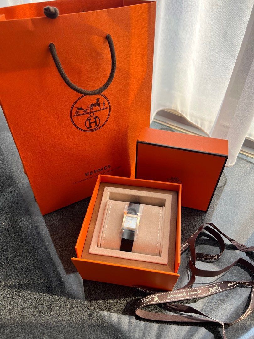 Authentic Hermes H Watch Small (Category: Luxury Watches) located in Quezon City. Submitted by breakmyfashion (Listing ID 1375342639, Image 2). Description: Customised Epsom Noir Leather and Mother of Pearl face. Comes in full set with receipt, box, paperbag and dust bag. .