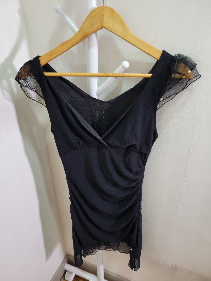 Black Asymmetrical Dress with Pearls (Category: Dresses) located in Las Pinas. Submitted by cabinetchasu (Listing ID 1375387922, Image 2). Description: Please read before messaging 🔻⬇️🔽👇 Details: - Offbrand but Taytay tiangge quality - Fitted type, hand me down dress but in okay quality - May part na manipis lang sa likod but overall everything is intact naman - Fits XS to S body frame - RFS decluttering - Can offer last price to sure buyers o