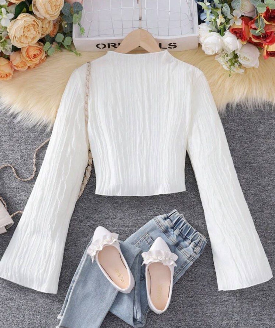 Elegant White Top with Long Flared Sleeves (Category: Longsleeves) located in Paranaque City. Submitted by floramese (Listing ID 1375432208, Image 1). Description: Used once, then was stored afterwards. ✿ lovely top that gives interesting texture and design!.