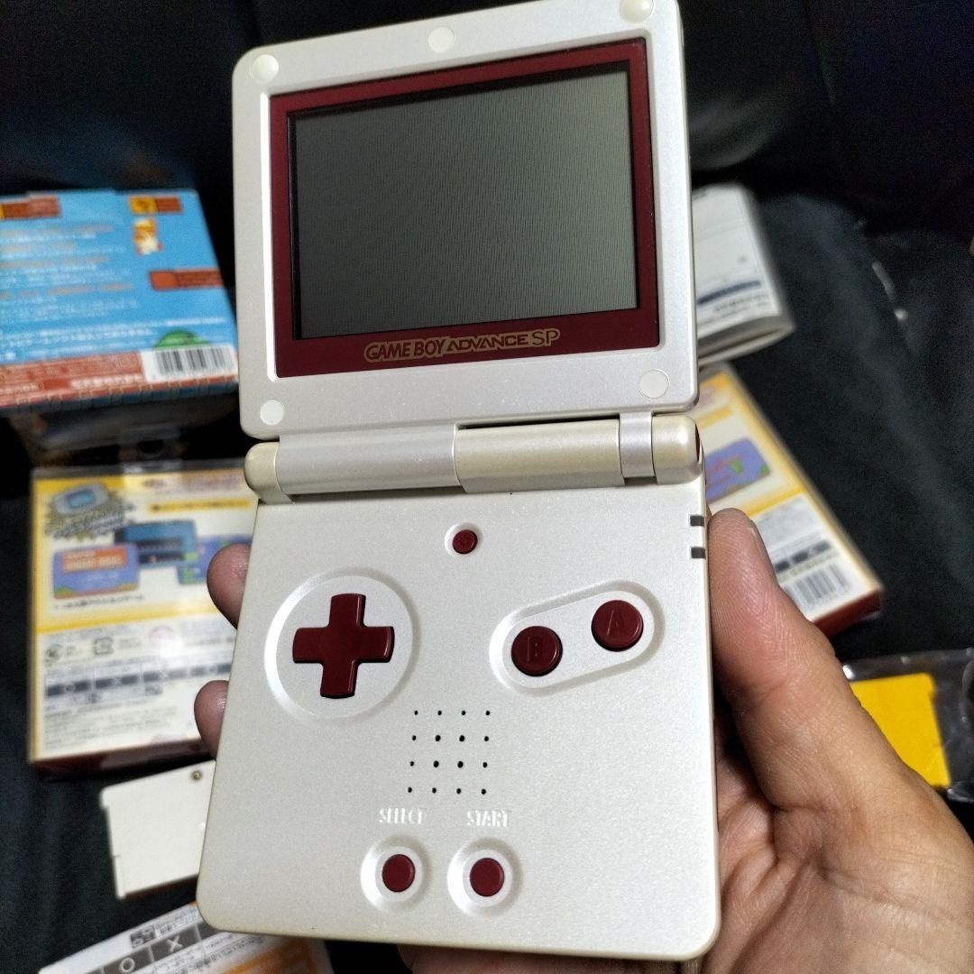 Game Boy Advance SP Famicom Color (Category: Nintendo) located in Manila. Submitted by japan_treasure (Listing ID 1375410185, Image 2). Description: There are a few scratches but otherwise it is in very good condition. Box, instructions and charger included. Operation has been confirmed..