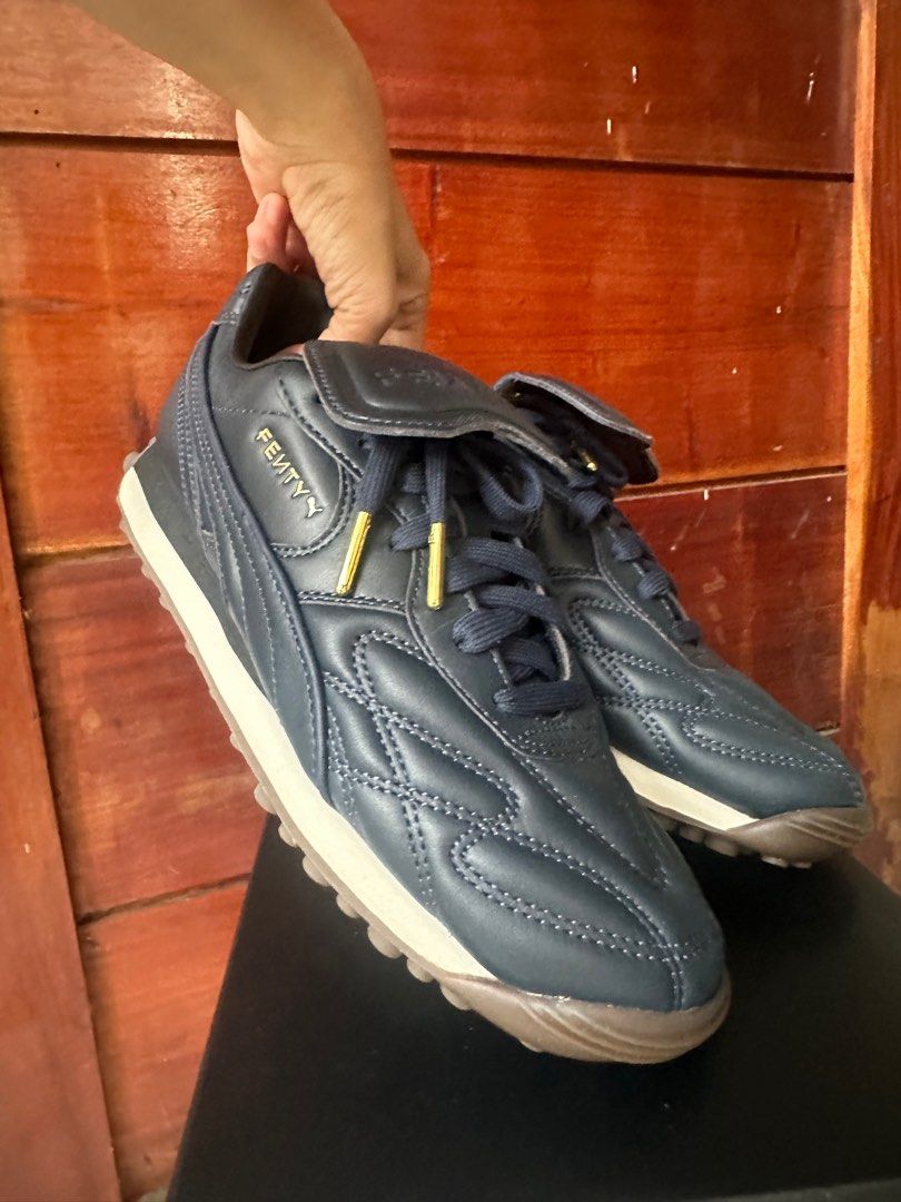 Puma x Fenty Avanti L (Category: Sneakers) located in Makati City. Submitted by ann_savvy (Listing ID 1375338149, Image 2). Description: Brand new complete with Velvet dust bag, box and extra shoe lace Puma x Fenty in Club Navy (Navy blue) I’m a 6.5-7 and this fits me well. Not yet worn, brand new condition. Price is negotiable but no lowballing please. 😊.