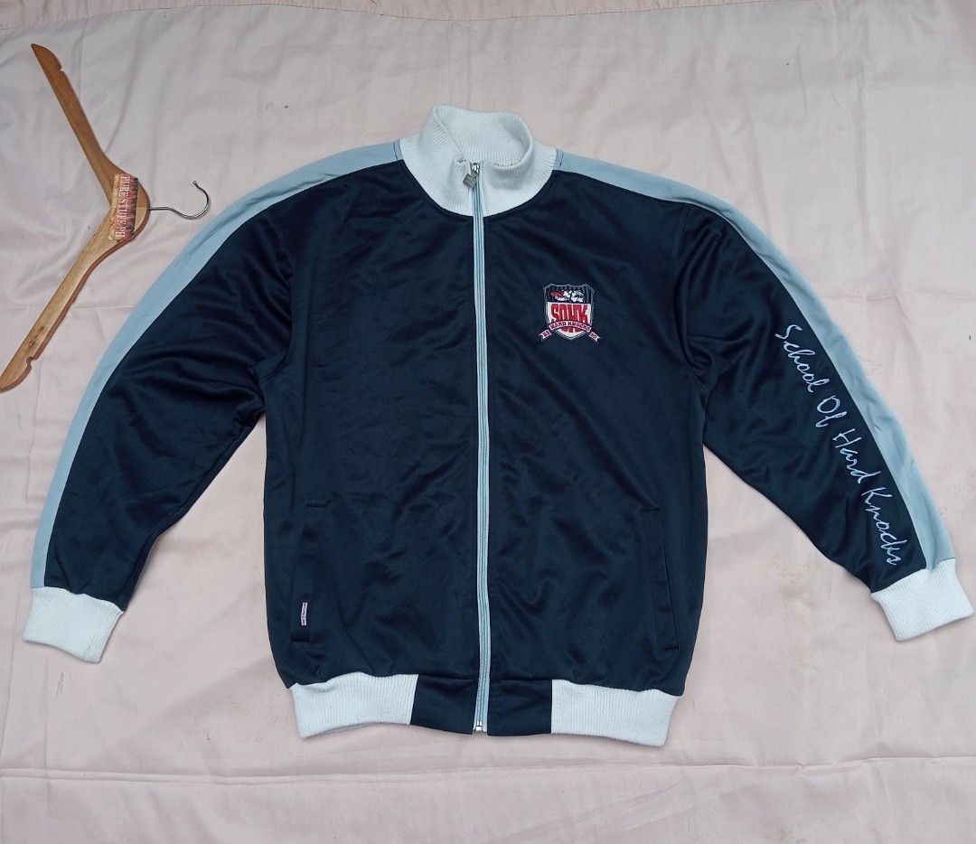 Vintage School of Hard Knocks track jacket (Category: Coats, Jackets and Outerwear) located in Pili. Submitted by purestuffph (Listing ID 1375333714, Image 2). Description: vintage School of Hard Knocks track jacket size: Large width: 22 length: 26.5 embroidered front and back logo's 9+/10 condition 850 + shipping fee or best offer.