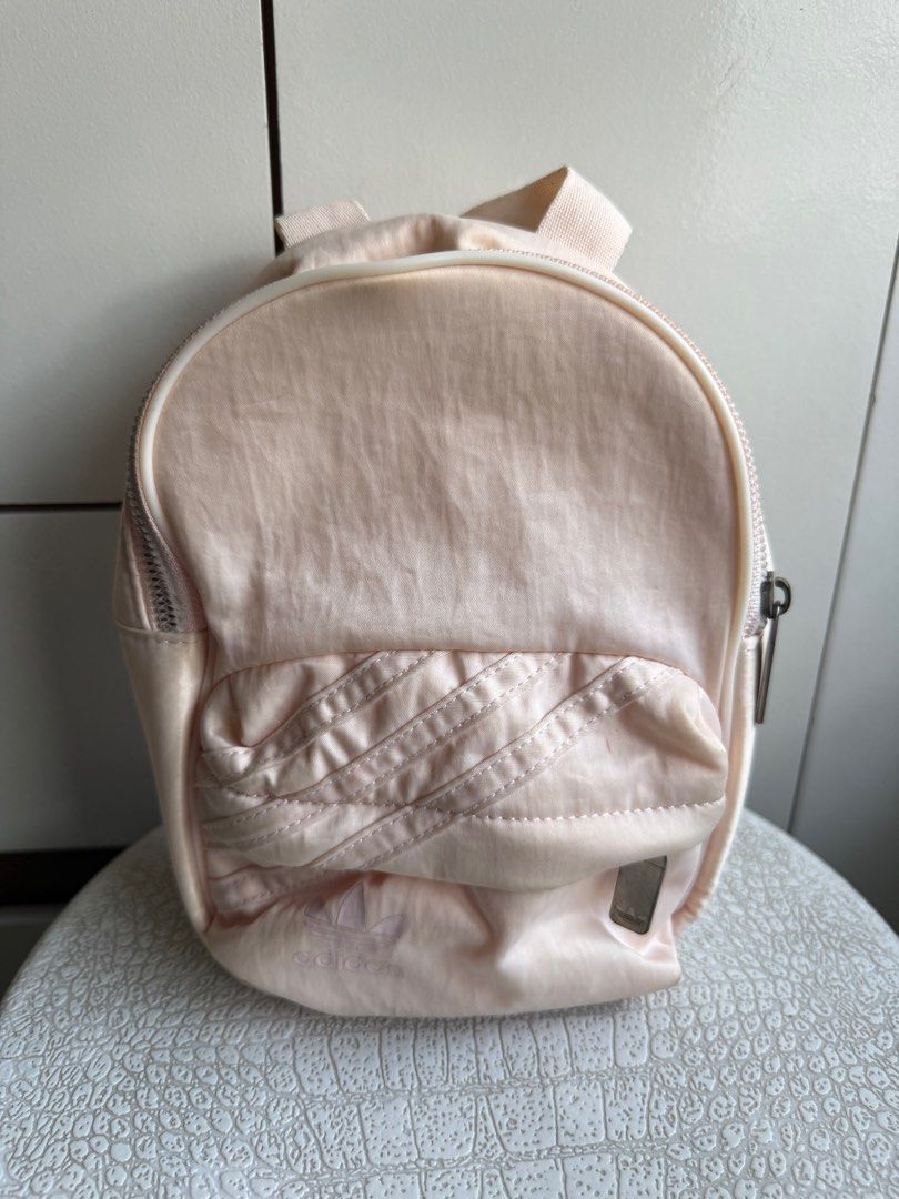 Adidas Mini Crossbody/Bagpack (Category: Backpacks) located in Manila. Submitted by sheisdecluttering (Listing ID 1375537191, Image 1). Description: ORIGINAL NEEDS CLEANING FADED ZIPPER WITH STRAP INSIDE MATERIAL: THICK SATIN.