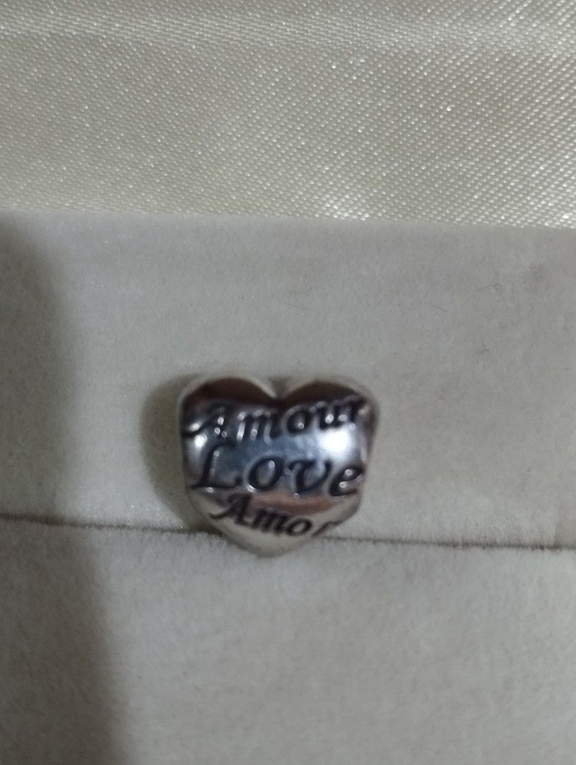 Authentic pand0ra "Language of Love" charm (Category: Charms) located in Manila. Submitted by raine0215 (Listing ID 1375514211, Image 2). Description: barely used pandora heart charm. rfs: i dont have the bracelet anymore.