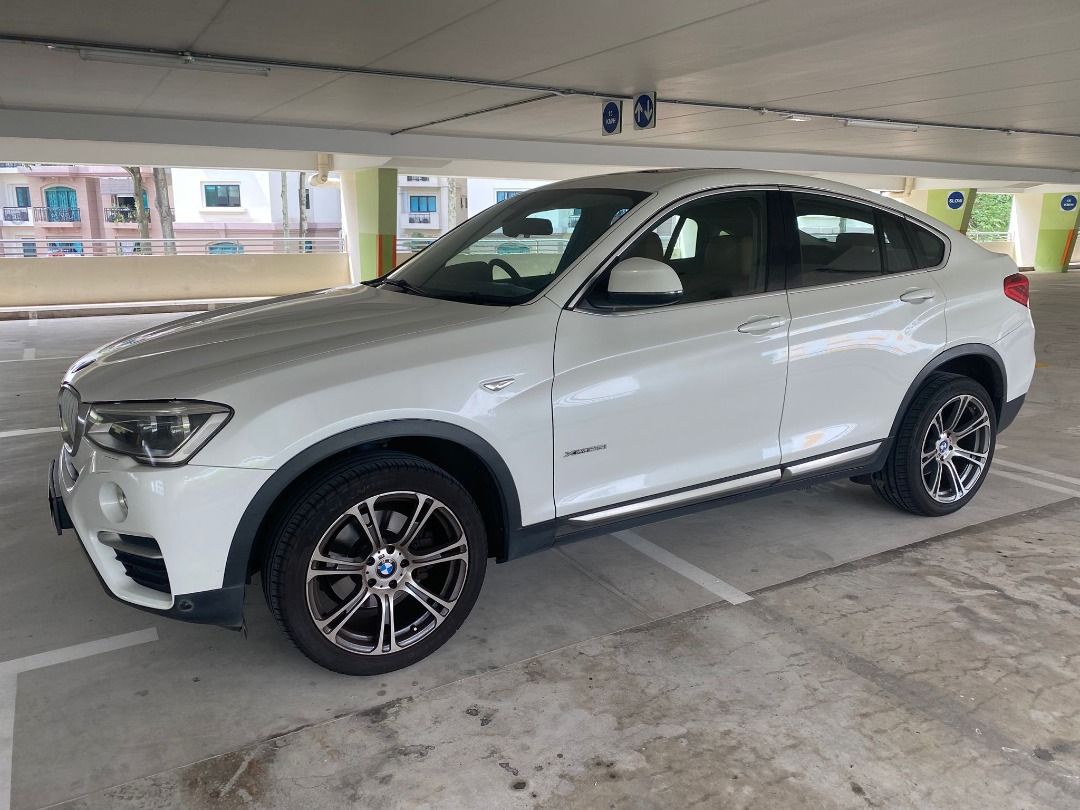 BMW X4 xDrive28i (A) (Category: Used Cars) located in Singapore. Submitted by fasterauto (Listing ID 1375523711, Image 2). Description: Powered By 2.0L Turbocharged Inline 4 Engine That Generate 241bhp And 350nm Of Torque Pair With Sport Mode Reliable Auto Drive Train And Paddle Shift. Very Well Maintained By Previous Owner. Powerful And Responsive Drive. Dual Tone Brown-Black Leather Interior. 100% Loan Available, Ex-Bankruptcy And Bad Credit We