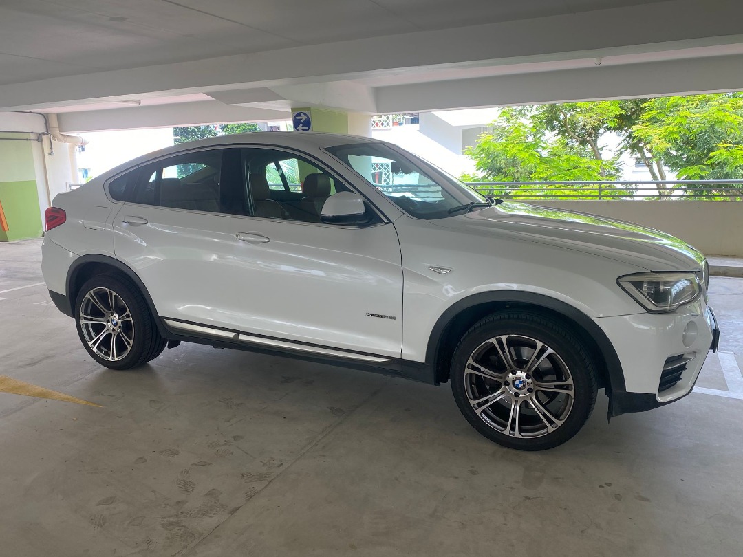 BMW X4 xDrive28i (A) (Category: Used Cars) located in Singapore. Submitted by fasterauto (Listing ID 1375523711, Image 3). Description: Powered By 2.0L Turbocharged Inline 4 Engine That Generate 241bhp And 350nm Of Torque Pair With Sport Mode Reliable Auto Drive Train And Paddle Shift. Very Well Maintained By Previous Owner. Powerful And Responsive Drive. Dual Tone Brown-Black Leather Interior. 100% Loan Available, Ex-Bankruptcy And Bad Credit We
