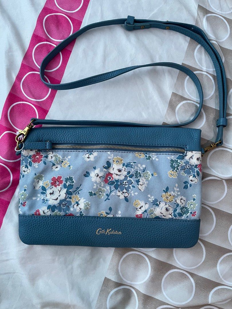 💚Cath Kidston sling bag - FP (Category: Luxury Bags & Wallets) located in Cabuyao City. Submitted by yhaniesgph (Listing ID 1375650054, Image 2). Description: In excellent condition. Due to storage, there are some yellowish on the floral part. No rubs just a minimal sign of use on the leather part. Rfs: too many bags Payment first Buyer to shoulder SF Cabuyao Laguna lox.