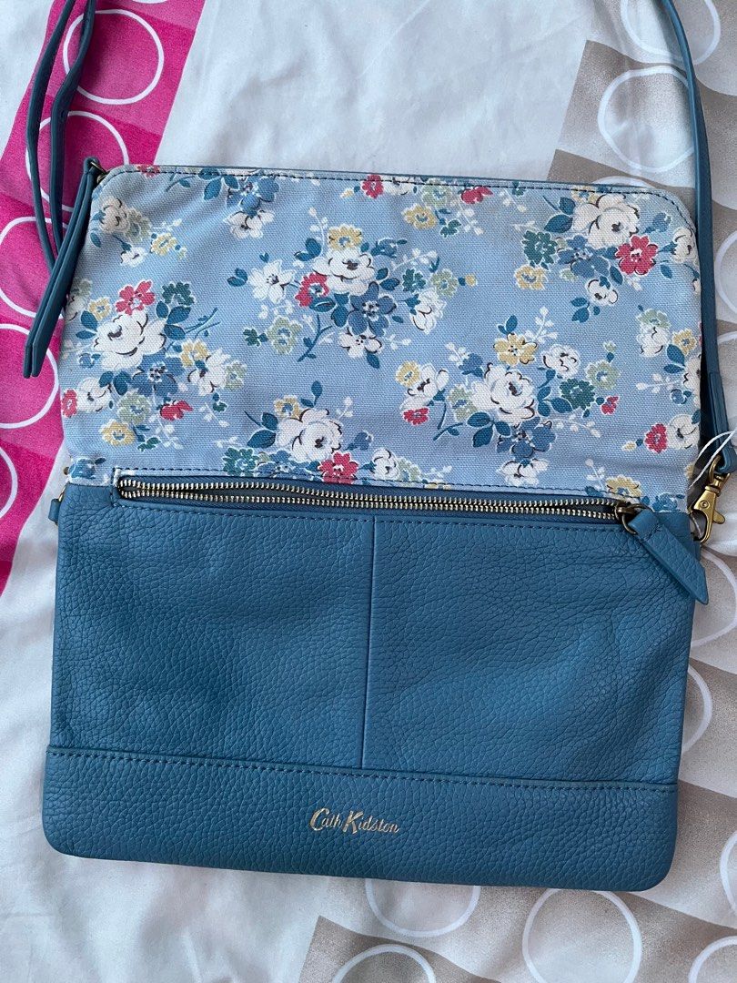 💚Cath Kidston sling bag - FP (Category: Luxury Bags & Wallets) located in Cabuyao City. Submitted by yhaniesgph (Listing ID 1375650054, Image 3). Description: In excellent condition. Due to storage, there are some yellowish on the floral part. No rubs just a minimal sign of use on the leather part. Rfs: too many bags Payment first Buyer to shoulder SF Cabuyao Laguna lox.