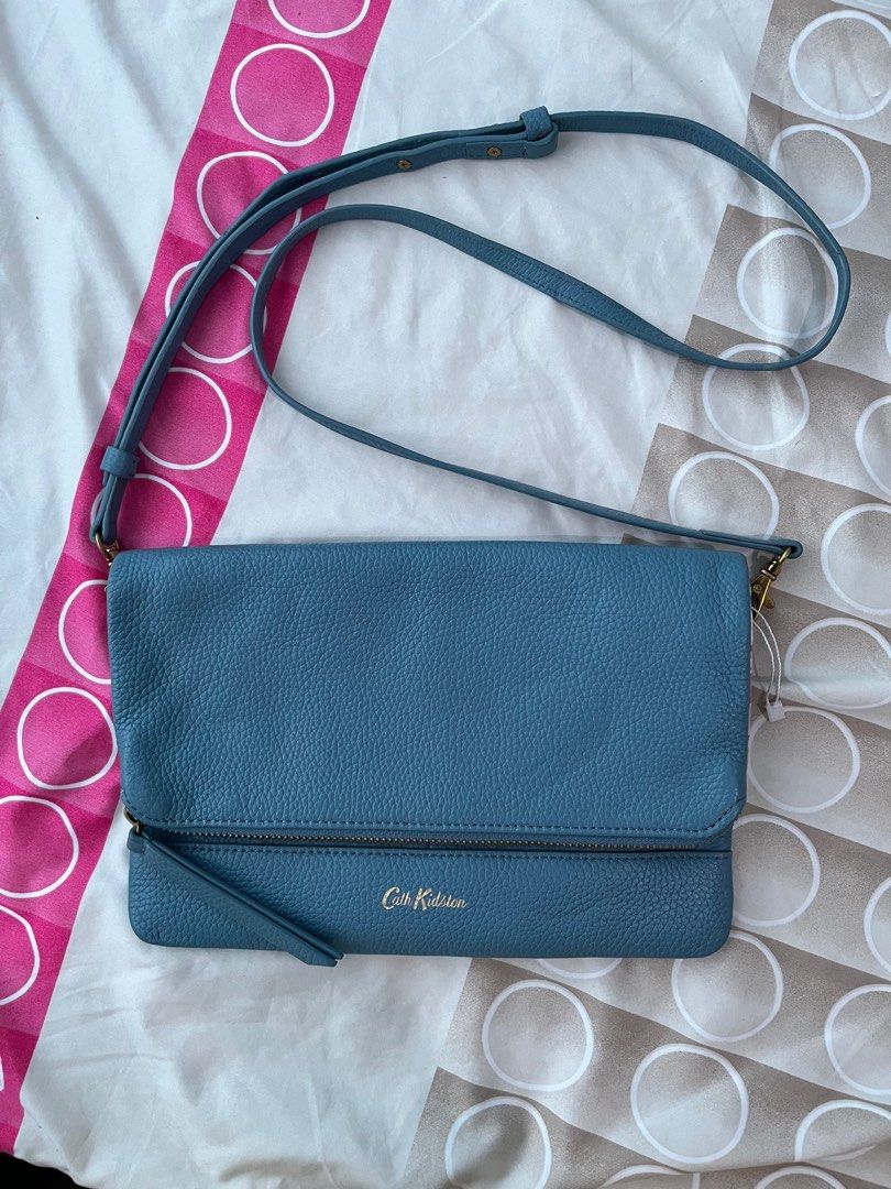 💚Cath Kidston sling bag - FP (Category: Luxury Bags & Wallets) located in Cabuyao City. Submitted by yhaniesgph (Listing ID 1375650054, Image 1). Description: In excellent condition. Due to storage, there are some yellowish on the floral part. No rubs just a minimal sign of use on the leather part. Rfs: too many bags Payment first Buyer to shoulder SF Cabuyao Laguna lox.