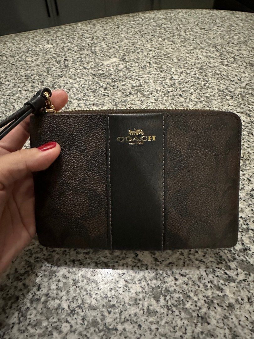 Coach Wristlet Wallet (Category: Luxury Bags & Wallets) located in Lipa City. Submitted by mariegaring (Listing ID 1375564853, Image 2). Description: Color : Wallnut Black 2 cardslots Ziptop closure 15cm L x 10cm H.