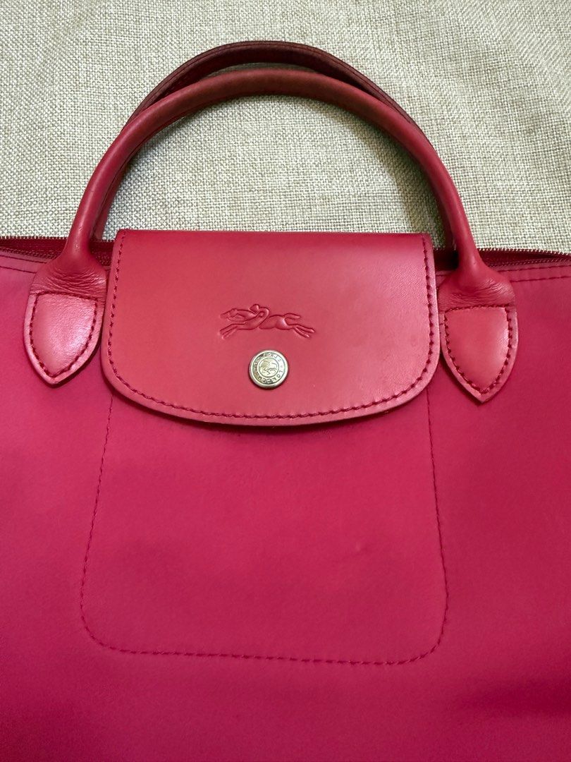 Longchamp Modele Depose Deep Pink (Category: Luxury Bags & Wallets) located in San Jose. Submitted by aldieph (Listing ID 1375622377, Image 3). Description: Height: 21cm Length: upper - 14cm, bottom - 20cm Width: 14cm Signs of usage, minimal ink stains Good rubber linings Overall good Issue: see photos Note: Color may vary due to camera lighting Please expect normal signs of usage if not brand new 599 + SF No Return, no exchange - shop w/ discret