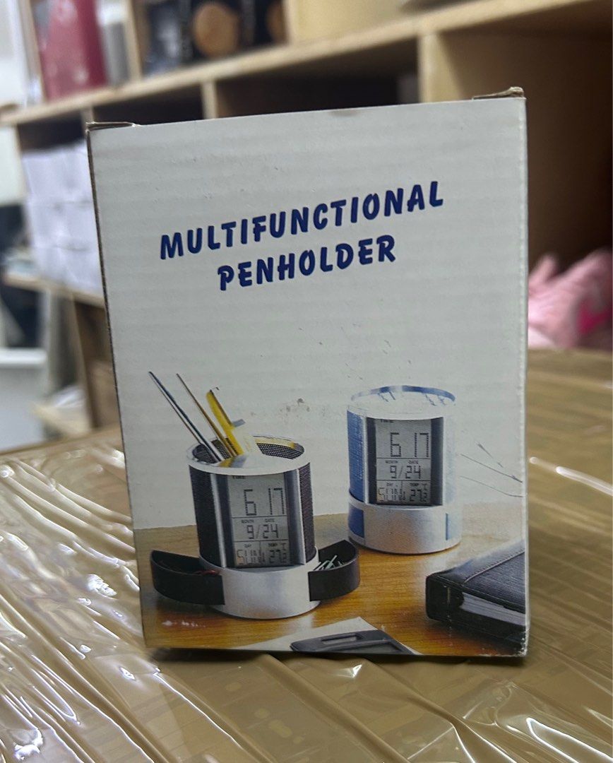 Multi function clock + pen holder （分類：時鐘）位於 Hong Kong。 由 a_surplus_shop 提交（商品編號 1375548984，圖片 3）。簡介： • Automatic drawer • Pen Holder • Countdown Timer • Alarm clock • Time Display • Temperature Display C/F。