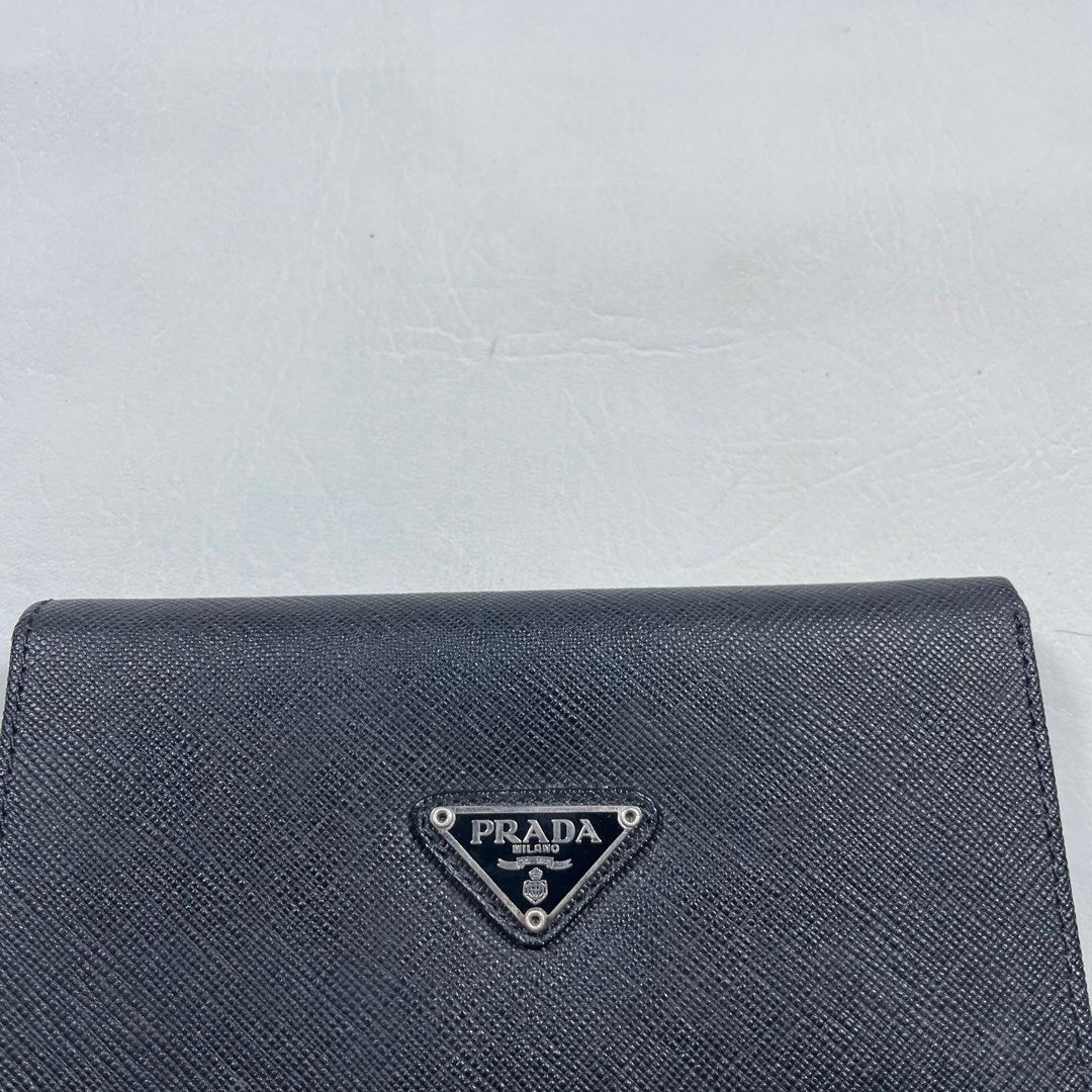 PRADA BLACK LEATHER TRI -FOLD LONG WALLET (Category: Luxury Bags & Wallets) located in Manila. Submitted by revise.ph_ (Listing ID 1375580115, Image 2). Description: PRADA BLACK LEATHER TRI -FOLD LONG WALLET Made in ITALY Dimension Length/Height:4 Width:6 Issue : Price:5,500 Free shipping Via JNT.