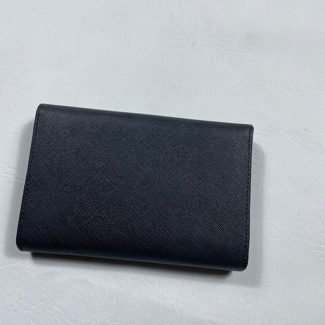 PRADA BLACK LEATHER TRI -FOLD LONG WALLET (Category: Luxury Bags & Wallets) located in Manila. Submitted by revise.ph_ (Listing ID 1375580115, Image 3). Description: PRADA BLACK LEATHER TRI -FOLD LONG WALLET Made in ITALY Dimension Length/Height:4 Width:6 Issue : Price:5,500 Free shipping Via JNT.