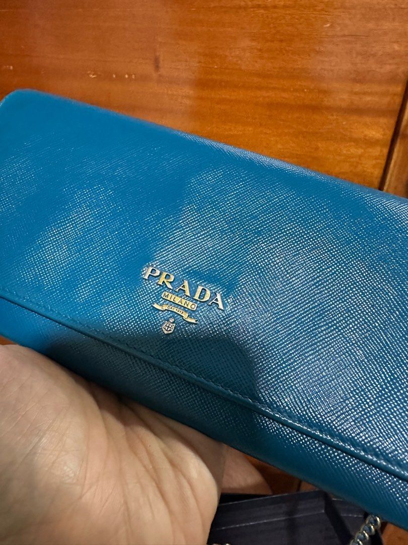 Prada wallet on chain (Category: Luxury Bags & Wallets) located in Makati City. Submitted by markussangabriel (Listing ID 1375625567, Image 1). Description: Good used condition..