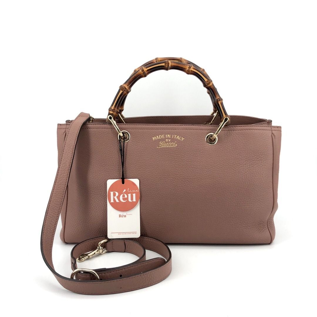 Reu 32371 Gucci - Bamboo Shopper Top Handle Bag with Strap (Category: Bags & Wallets) located in Singapore. Submitted by Reu_App (Listing ID 1375523715, Image 1). Description: Material: Calf Leather Color: Brown Size: 34 x 21 x 14cm Item is available to view at Singapore 🇸🇬 marina one #01-03 store S018935 WA: 81814221 for detailed photos or videos Check Reu App for grab pay, DBS installment or further markdown Tele & linktree: lcreustore.