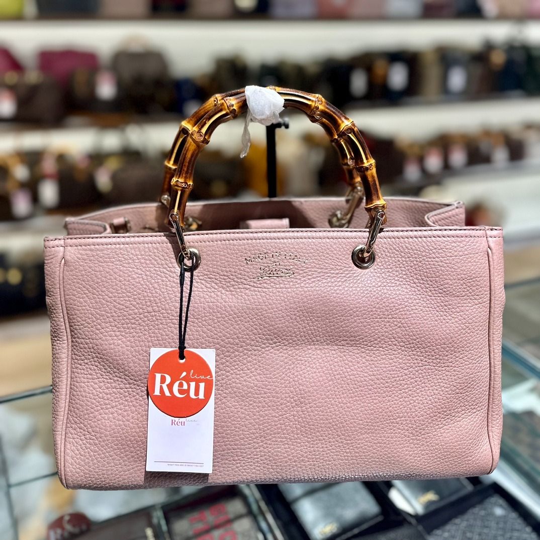Reu 32371 Gucci - Bamboo Shopper Top Handle Bag with Strap (Category: Bags & Wallets) located in Singapore. Submitted by Reu_App (Listing ID 1375523715, Image 2). Description: Material: Calf Leather Color: Brown Size: 34 x 21 x 14cm Item is available to view at Singapore 🇸🇬 marina one #01-03 store S018935 WA: 81814221 for detailed photos or videos Check Reu App for grab pay, DBS installment or further markdown Tele & linktree: lcreustore.