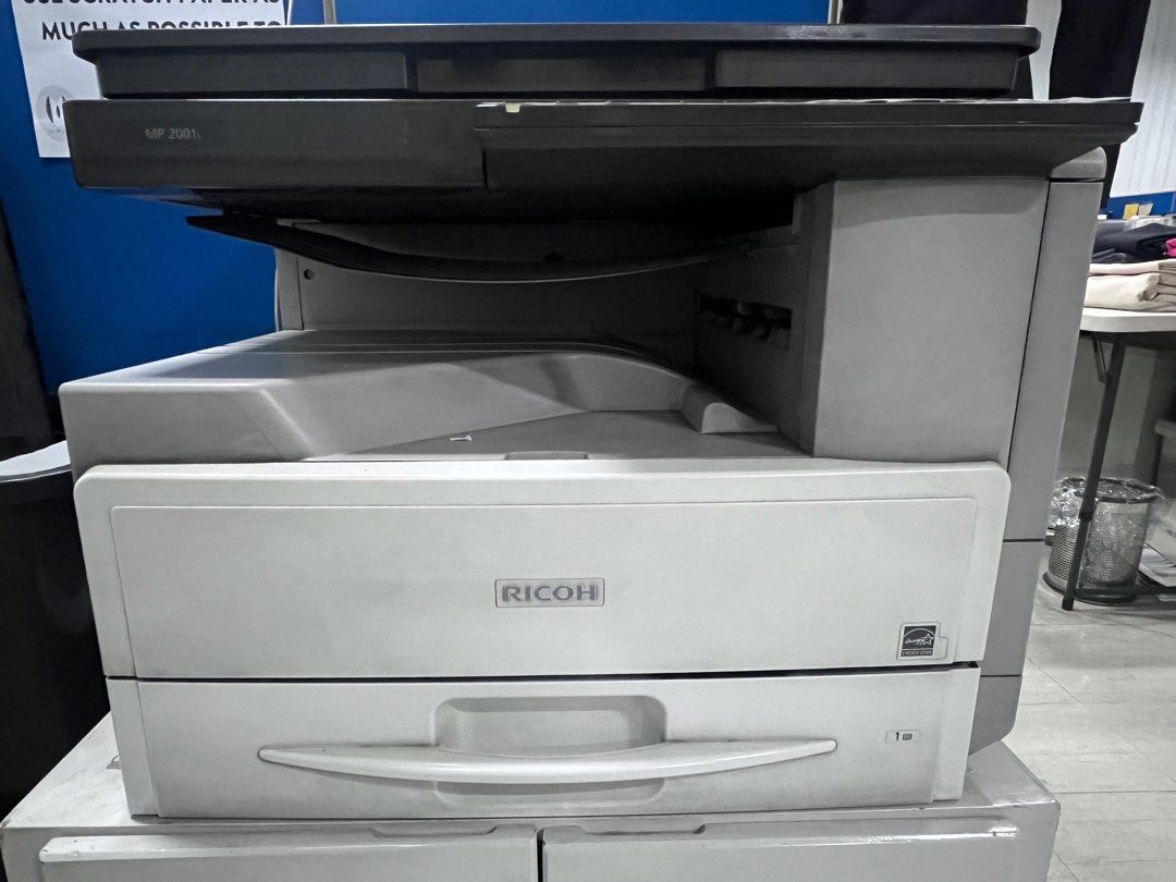 Ricoh scanner printer photocopier MP2001L (Category: Printers, Scanners & Copiers) located in Quezon City. Submitted by camillelaude (Listing ID 1375561631, Image 2). Description: Still working as is, could print copy and scan. Machine only, table not included. As is where is just needs cleaning. Rfs: Upgrade Shipping care of buyer. Location: Makati .