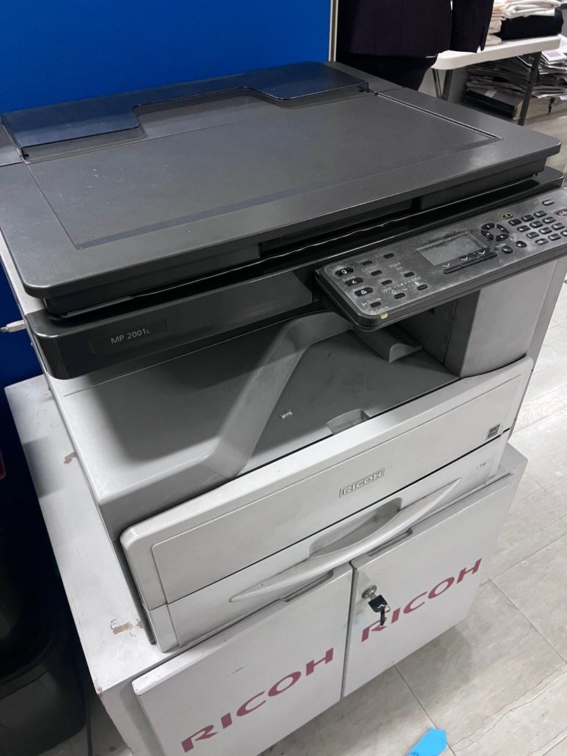 Ricoh scanner printer photocopier MP2001L (Category: Printers, Scanners & Copiers) located in Quezon City. Submitted by camillelaude (Listing ID 1375561631, Image 1). Description: Still working as is, could print copy and scan. Machine only, table not included. As is where is just needs cleaning. Rfs: Upgrade Shipping care of buyer. Location: Makati .