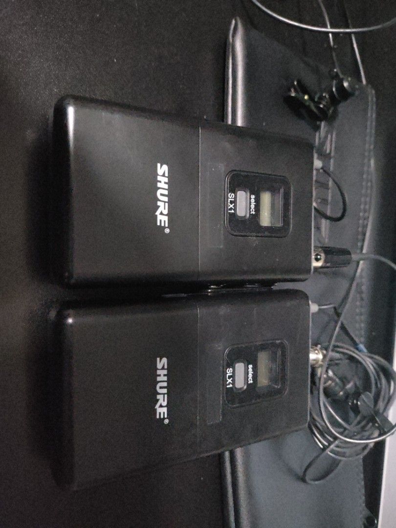 Shure SLX1 Wireless Microphone System (Category: Microphones) located in Singapore. Submitted by techdms (Listing ID 1375614712, Image 2). Description: Grab this Shure SLX1 wireless microphone system! It includes two handheld microphones and two bodypack transmitters with lavalier microphones. The receiver is also included. Ideal for presentations, performances, or any audio recording. Get yours today!.