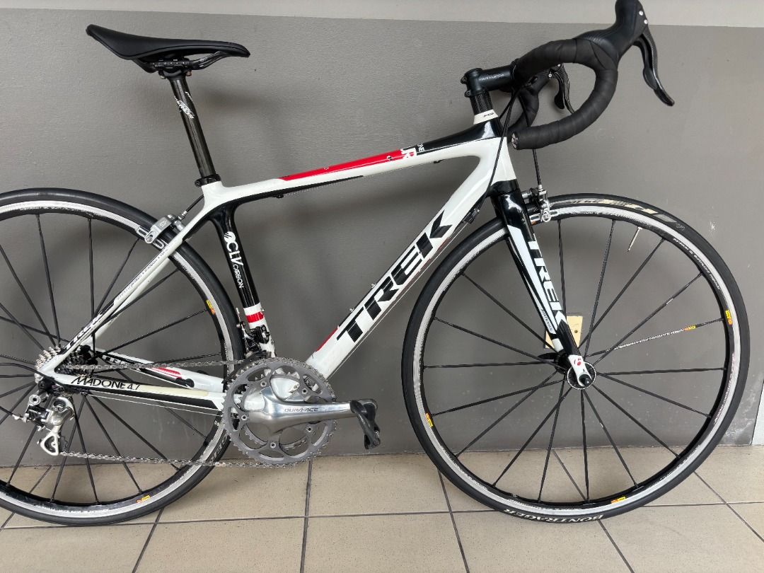 Trek Madone 4.7 Carbon Bicycle size 50, 7.23kg (Category: Bicycles) located in Singapore. Submitted by philipmehl (Listing ID 1372888835, Image 1). Description: High quality bike, brand as used by winning pro-team Lidl-Trek Professionally rebuilt from scratch, with new saddle, chain, bearings and wheels all trued up Perfect working order, and in great condition for its age, model year G / 2012 Amazing spec of Campagnolo, Dura Ace etc and with ped