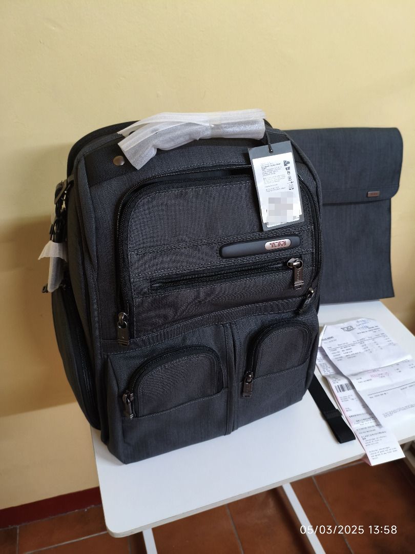 Tumi backpack bag (Category: Backpacks) located in Pasig City. Submitted by johnalvin (Listing ID 1367369766, Image 2). Description: Tumi Compact Laptop Brief Pack original from Tumi Store - Hong Kong backpack , with included laptop bag inside brand new , not used with : still attached pricetag , original plastic cover , original tumi black silk pouch will show you original receipt to prove authenticity location : Taytay , Rizal , Eastwood City (