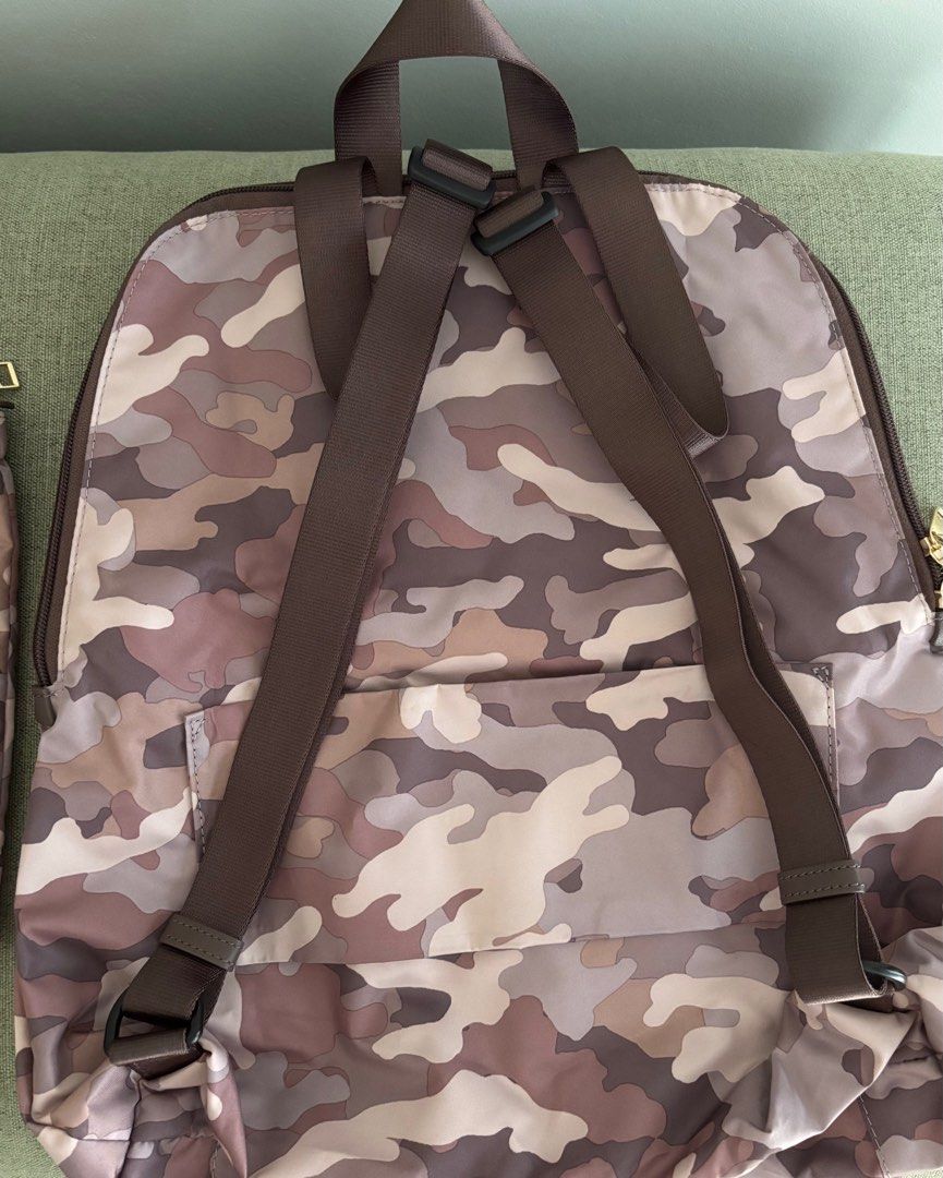 Sale! Almost new Tumi foldable backpack (Category: Luxury Bags & Wallets) located in Taguig. Submitted by museumile (Listing ID 1375609472, Image 3). Description: Authentic TUMI foldable travel backpack in canvas camouflage pink / gray. Lightweight & functional. Used 2x only , very clean inside & out. Comes with a pouch to place the folded backpack in. RFS: Not using anymore. Payment: BPI or Gcash. Shipping fee c/o buyer. .