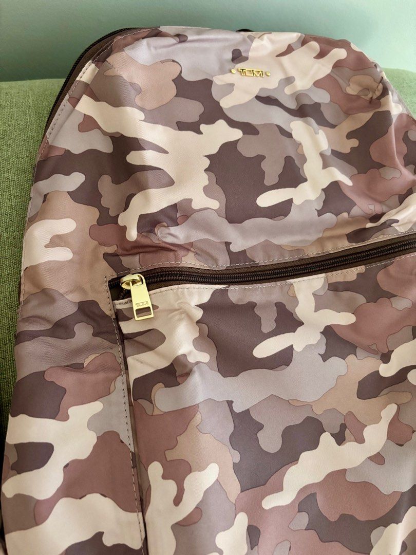 Sale! Almost new Tumi foldable backpack (Category: Luxury Bags & Wallets) located in Taguig. Submitted by museumile (Listing ID 1375609472, Image 2). Description: Authentic TUMI foldable travel backpack in canvas camouflage pink / gray. Lightweight & functional. Used 2x only , very clean inside & out. Comes with a pouch to place the folded backpack in. RFS: Not using anymore. Payment: BPI or Gcash. Shipping fee c/o buyer. .