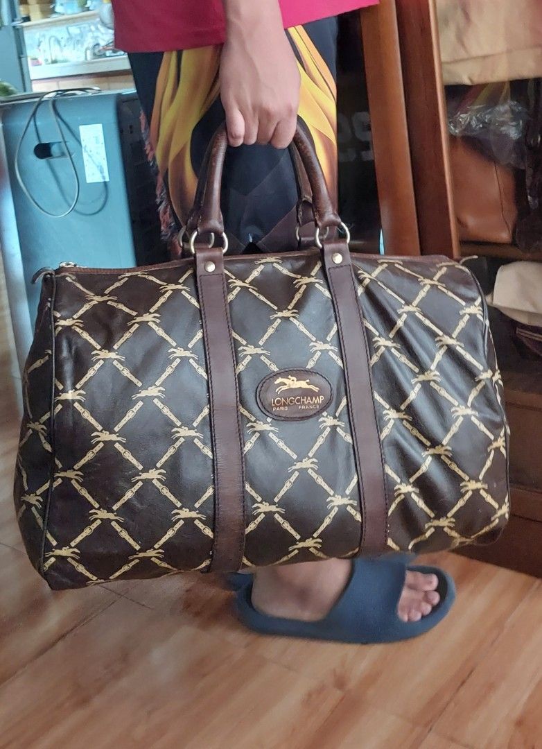 Vintage Longchamp Travel bag (Category: Luxury Bags & Wallets) located in Davao. Submitted by wengbagstuff (Listing ID 1375474366, Image 2). Description: ✅️ Vintage bag of 1980's ✅️ genuine leather ✅️ eclair zipper ✅️ w/ issues sa handle, needs twilly or repair ✅️ no open pipes, tiny cracks on lips but manageable..