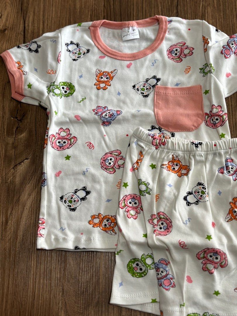 Adorable Panda Cartoon Print Pajamas Set (Category: Babies & Kids Fashion) located in Singapore. Submitted by discountdazzle (Listing ID 1375696361, Image 2). Description: Super cute pajamas set featuring an all-over panda and animal print. The set includes a short-sleeved top with a peach pocket and matching shorts. Made from soft and comfortable material, perfect for your little one's bedtime. The shorts have an elastic waistband for a snug fit