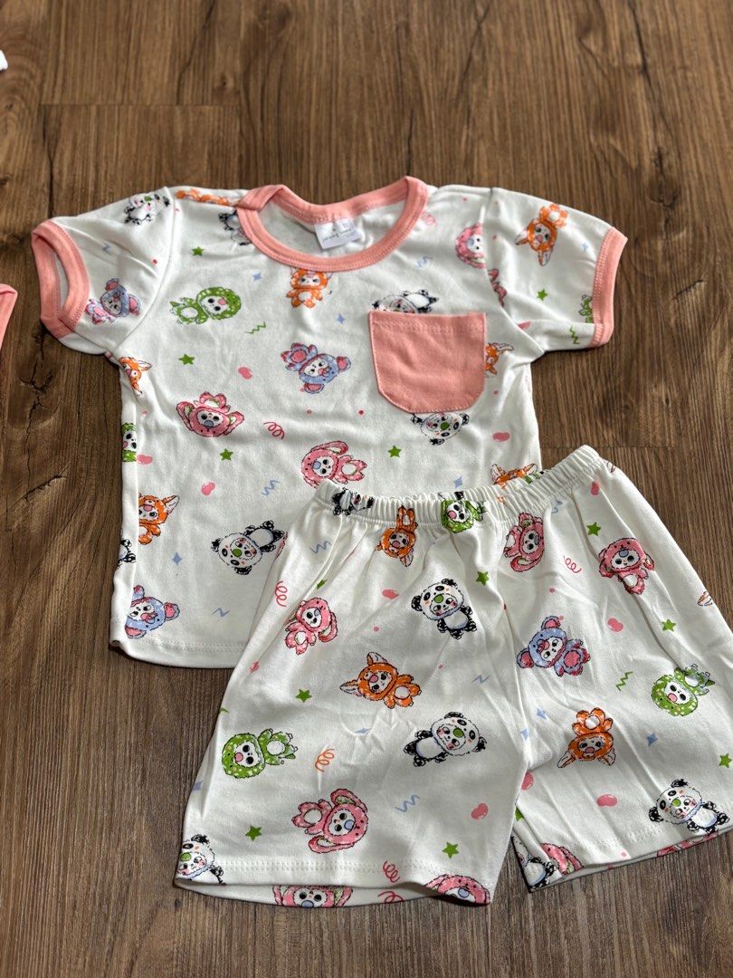 Adorable Panda Cartoon Print Pajamas Set (Category: Babies & Kids Fashion) located in Singapore. Submitted by discountdazzle (Listing ID 1375696361, Image 3). Description: Super cute pajamas set featuring an all-over panda and animal print. The set includes a short-sleeved top with a peach pocket and matching shorts. Made from soft and comfortable material, perfect for your little one's bedtime. The shorts have an elastic waistband for a snug fit
