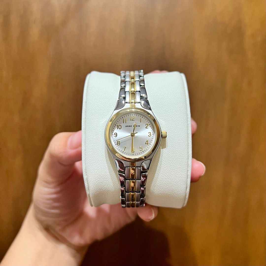 Anne Klein Two-Tone Dress Watch (Category: Women's Watches) located in Binan City. Submitted by labella.craze (Listing ID 1375774026, Image 1). Description: Details: ✅Mineral crystal lens: silver-tone dial with gold-tone easy-to-read Arabic numerals ✅Two-tone adjustable link bracelet; jewelry clasp and extender link Inner band circumference: 7 inches ✅Japanese quartz movement ✅Case diameter: 26 millimeters ✅Water resistant to 30 meters (99 feet):