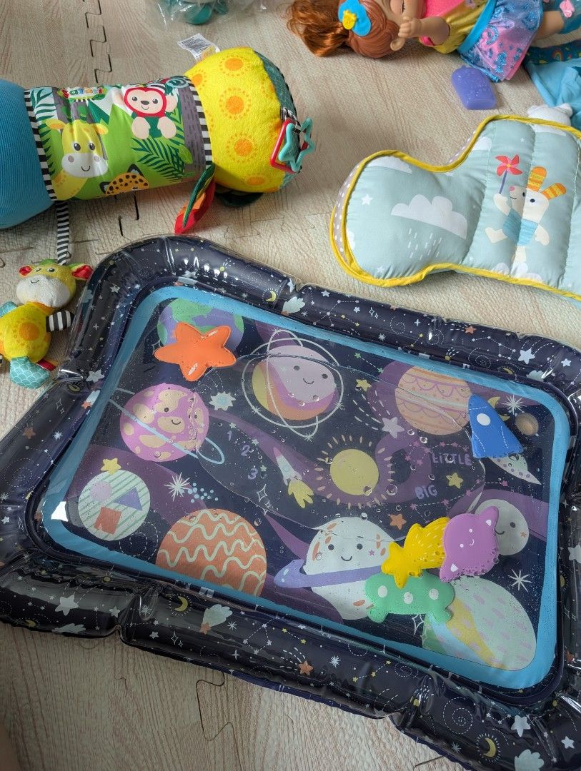 Assorted tummy time toys (Category: Infant Playtime) located in Manila. Submitted by usedfurnituremnl (Listing ID 1375660481, Image 1). Description: includes water mat, angled pillow and tummy time roller pillow. all purchased in Dec 2024.