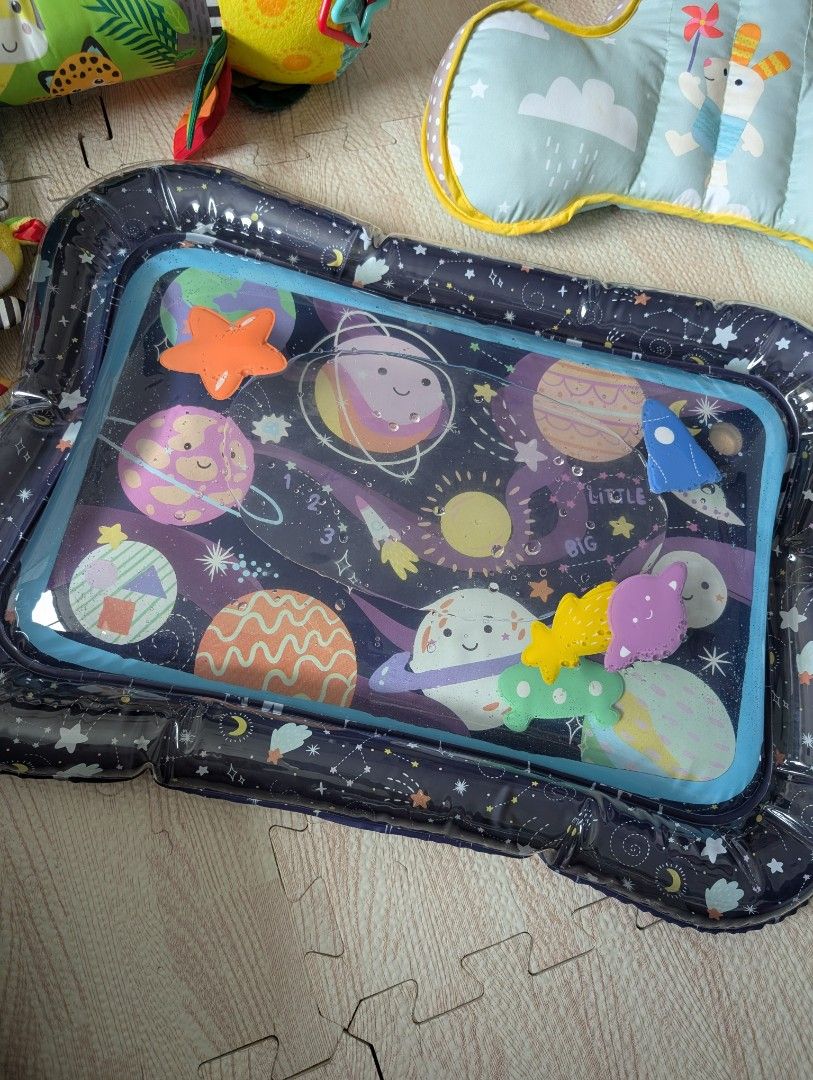 Assorted tummy time toys (Category: Infant Playtime) located in Manila. Submitted by usedfurnituremnl (Listing ID 1375660481, Image 2). Description: includes water mat, angled pillow and tummy time roller pillow. all purchased in Dec 2024.