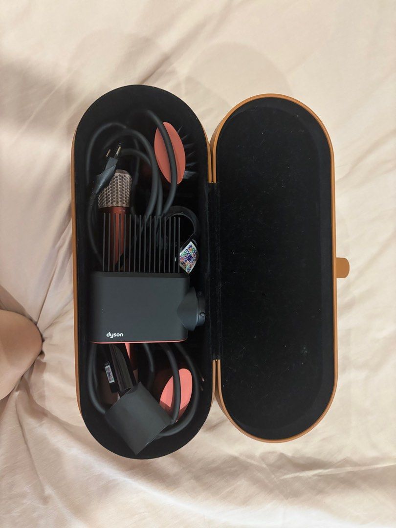 Dyson Airwrap ID (Category: Hair) located in Quezon City. Submitted by cavemandraws (Listing ID 1375664601, Image 1). Description: ✨Original & Authentic ✨barely used ✨app registration ✨hair profiles included ✨includes 2 barrells, 2 brushes, wide tooth & smoothing dryer Last Price Posted Pls Negotiable only to pickup same day .