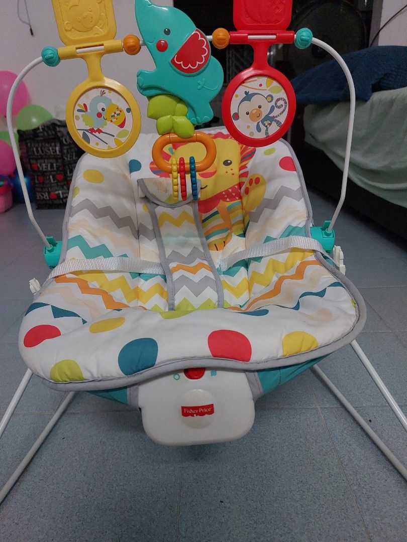 Fisher-Price Infant Bouncer (Category: Infant Playtime) located in Singapore. Submitted by abhilashcj (Listing ID 1375774924, Image 1). Description: Fisher-Price infant bouncer with a fun jungle animal theme. Includes a toy bar with hanging toys. Lightweight and foldable, perfect for newborns and infants..