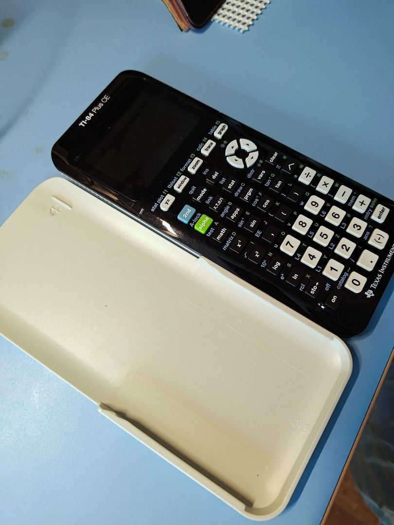 [FULL SET] Texas Instruments TI-84 Plus CE Graphing Calculator for Polytechnic, Junior College, A-levels, University (Category: Office & Business Technology) located in Singapore. Submitted by notesfromnus (Listing ID 1375808254, Image 2). Description: Calculator with charging wire! Comes fully charged. All buttons and functions working in good condition. - Texas Instruments TI-84 Plus CE calculator - Includes a hard case - Backlit display - Full