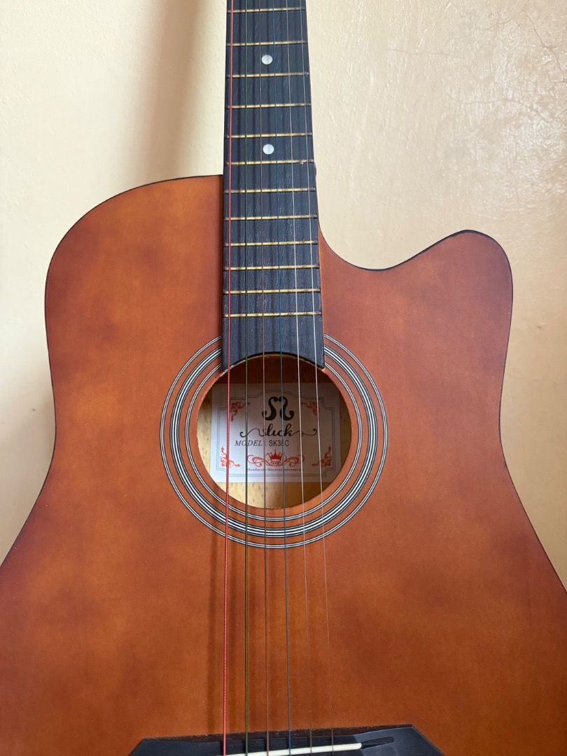 Guitar for sale (Category: Musical Instruments) located in Valenzuela. Submitted by gsapla (Listing ID 1375723770, Image 2). Description: Slick 38' inches colorful acoustic guitar with trussrod (Brown) RFS: Barely used FREEBIES: -Guitar Bag -Capo -Strap -guitar pick Meetup: Valenzuela area or Marilao only Shipping: thru Lalamove, buyer to handle sf, pay half before shipping.