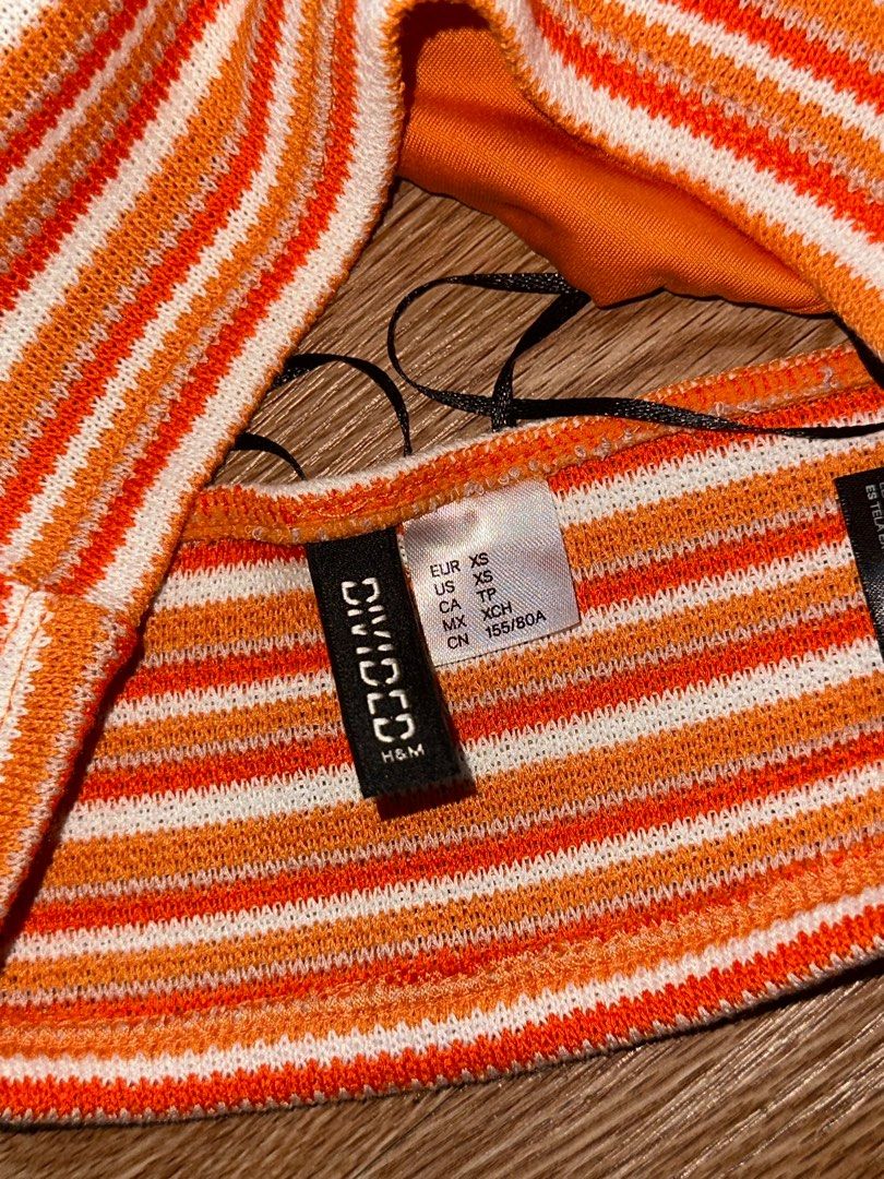 H&M Orange Striped Backless Halter Top (Category: Sleeveless) located in Manila. Submitted by decluttering77 (Listing ID 1375821758, Image 2). Description: - 10/10 condition - flattering! perfect for the summer - size xs on tag MOP: GCASH *will not ship unless fully paid.