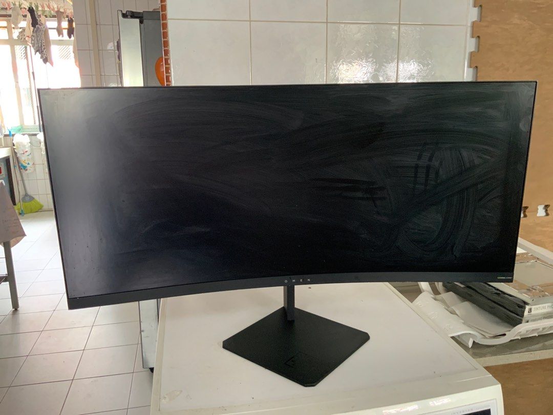 The HP Omen X 35, HP Omen Curved Gaming Monitor (Category: Monitor Screens) located in Singapore. Submitted by mikemeng (Listing ID 1375724824, Image 1). Description: 4K HP Omen curved monitor. Features a sleek black design and a sturdy stand. The screen is large and has excellent viewing angles. Ports are visible on the back. This monitor is perfect for gaming or other visual tasks. model :The HP Omen X 35 Screen size: 35-inch Native resolution: