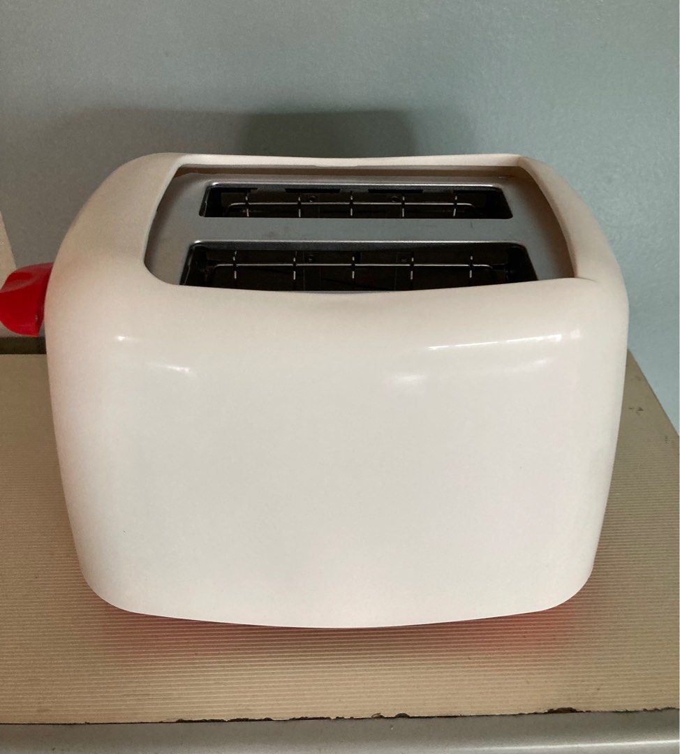 Moulinex Principio Bread Toaster (Category: Ovens & Toasters) located in Manila. Submitted by daddythrifter (Listing ID 1375751915, Image 2). Description: Two slot, 1-6 browning settings, cancel button, high lift, removable crumb tray Color: white Length: 9” Height 7.5” Issue: slight stain due to storage as shown in last pic.