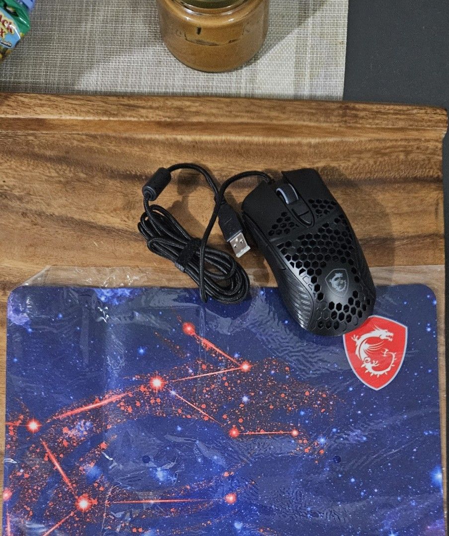 MSI M99 Pro gaming mouse with free mousepad (Category: Mouse & Mousepads) located in Quezon City. Submitted by schizofragile (Listing ID 1375751632, Image 2). Description: Selling a brand new MSI M99 Pro gaming mouse (wired) with free MSI mousepad. No box because I got this as a freebie • Non-slip 3D Wheel Design • Cool Air Ergonomic Shape Design • Anti-skid grip • RGB streamer design • 4000 dpi resolution • 20G Acceleration • Switch life: 20 mil
